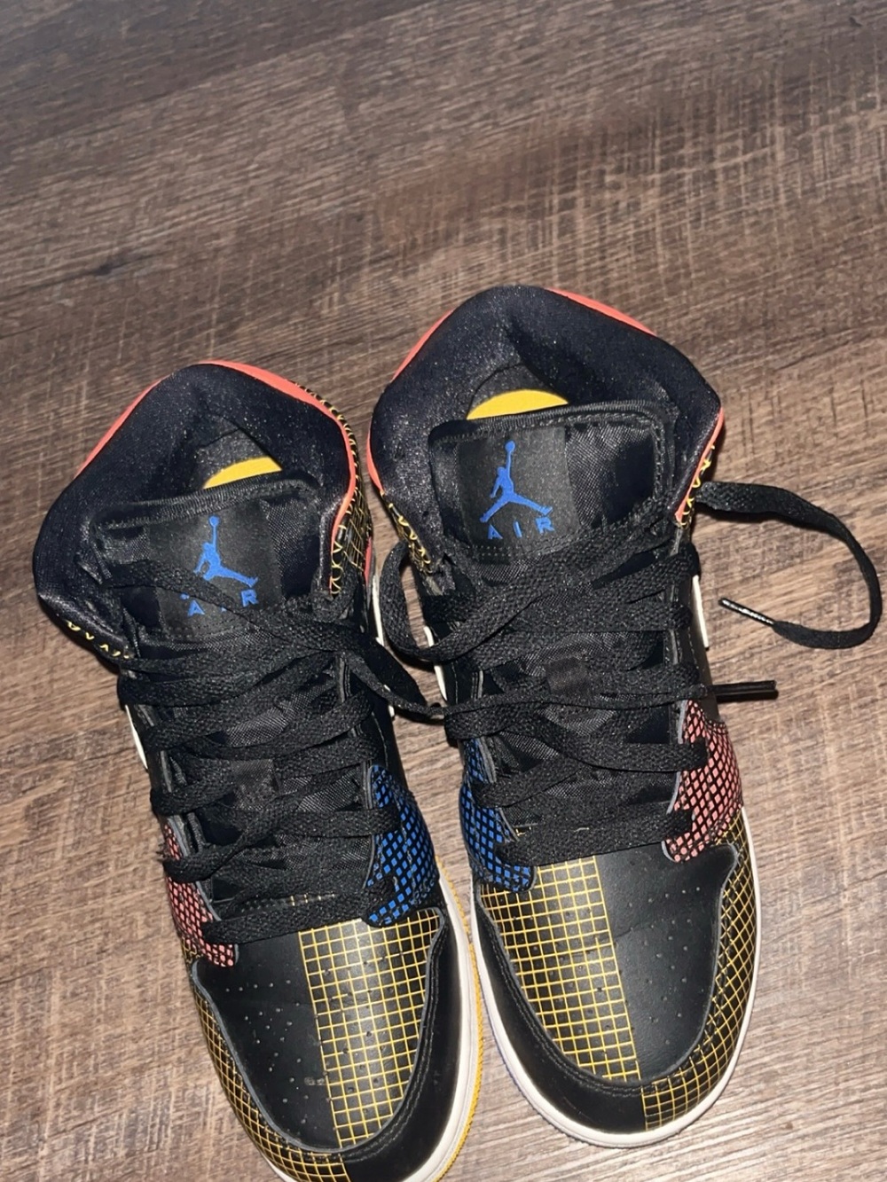 Jordan Black High-Top Sneakers with Red, Blue & Yellow Accents